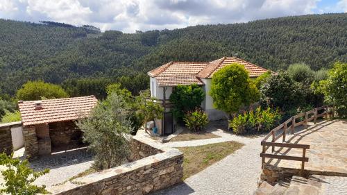 a villa with a view of a mountain at Casa Laranjeira in Vale de Cameiro