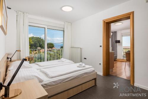 Posteľ alebo postele v izbe v ubytovaní Apartments Rona Erea Icici