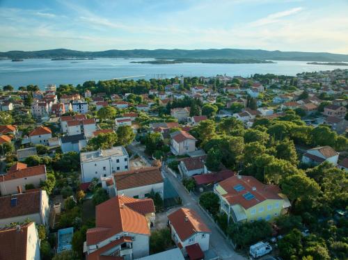 an aerial view of a city with a lake at Apartments Petrina in Sveti Filip i Jakov