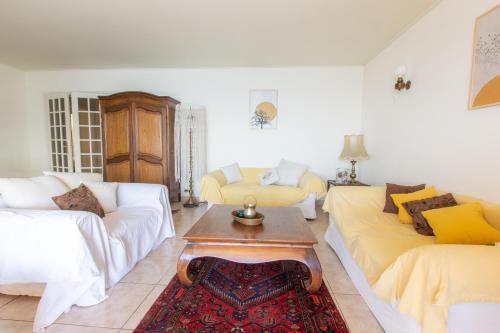 a living room with two couches and a coffee table at Gozzi in Ajaccio