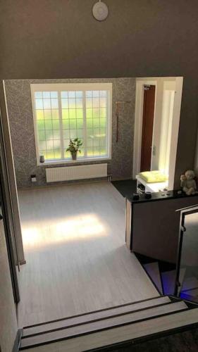 an empty living room with a window and a sink at Villa a Hovås con molti comfort in Hovås