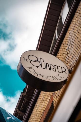 a sign on the side of a building at The Old Quarter Townhouse in Limerick