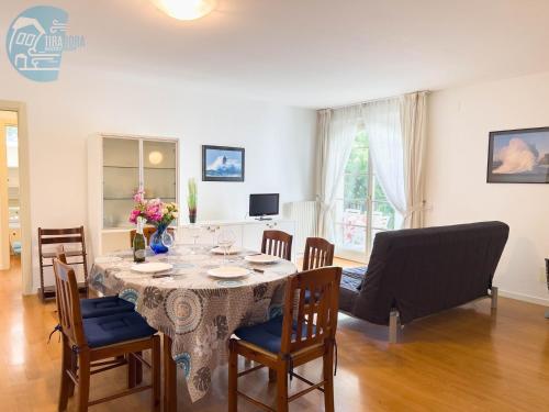 a dining room with a table and chairs at Cattedrale 5 Tirabora Short Rent in Trieste