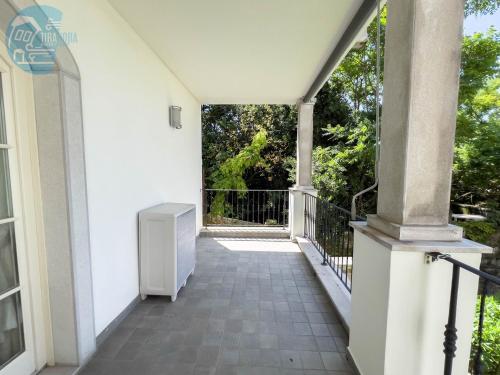 an empty balcony of a house with a window at Cattedrale 5 Tirabora Short Rent in Trieste