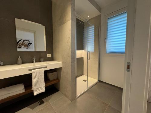 a bathroom with a shower and a sink and a mirror at B&B Room47 in Alba Adriatica