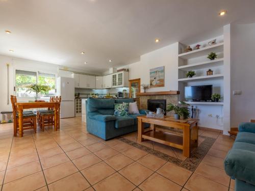 a living room with a couch and a table at Villa Imma by Interhome in L'Eucaliptus