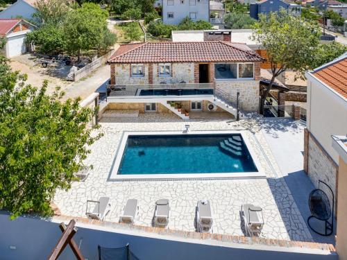 an aerial view of a house with a swimming pool at Holiday Home Villa Frane by Interhome in Maslenica