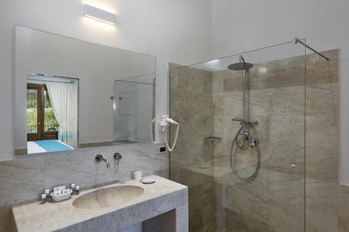 a bathroom with a sink and a shower at Sentido Orosei Beach in Orosei