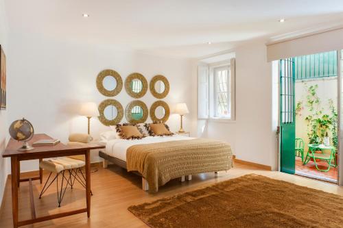 A bed or beds in a room at Rossio - Chiado | Lisbon Cheese & Wine Apartments