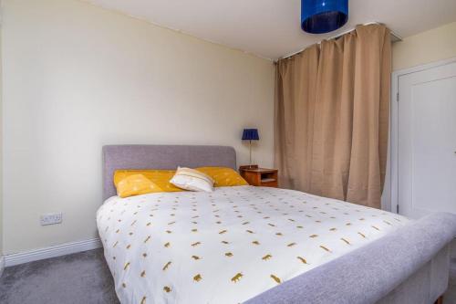 a bedroom with a large bed with yellow pillows at The Chancery in Dublin