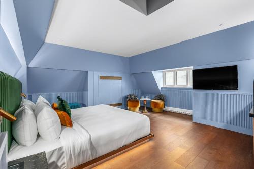 Postel nebo postele na pokoji v ubytování Hôtel Maurice