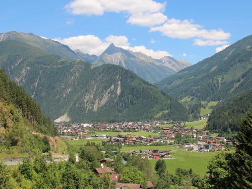 a small town in a valley in the mountains at Apartment Kröll beim Geislerhof by Interhome in Ramsau