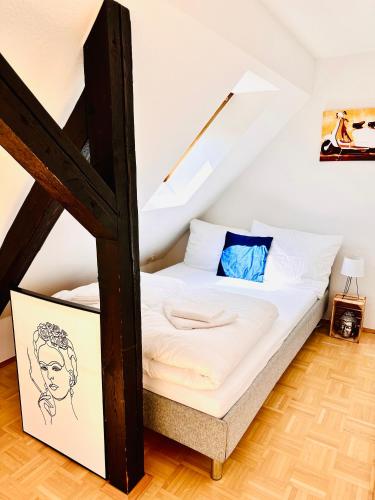 a bedroom with a bed in a attic at Massive Karli Loft - over 130 meters floor space - home theater room - 4 private sleeping areas - best location in Leipzig in Leipzig