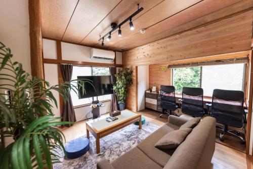 a living room with a couch and a table at 春夏秋冬 in Hakone