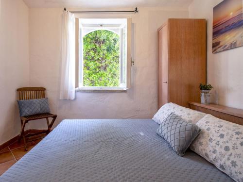 Katil atau katil-katil dalam bilik di Holiday Home Capriccioli B by Interhome