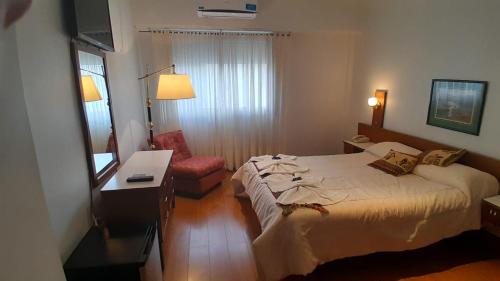 Letto o letti in una camera di Hotel Perugia