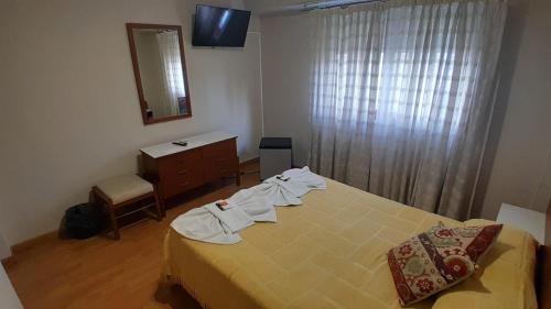 Letto o letti in una camera di Hotel Perugia