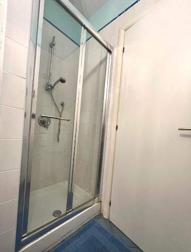 a shower with a glass door in a bathroom at Residenza Le Spiagge in Sperlonga