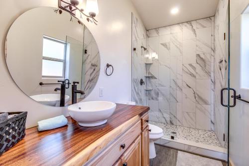 a bathroom with a sink and a mirror at Near Hiking Trails Overgaard Home with Large Yard! in Overgaard