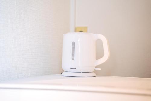 a white mixer sitting on top of a counter at 春夏秋冬 in Hakone
