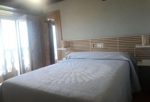 Ένα ή περισσότερα κρεβάτια σε δωμάτιο στο La Calzada del Canto
