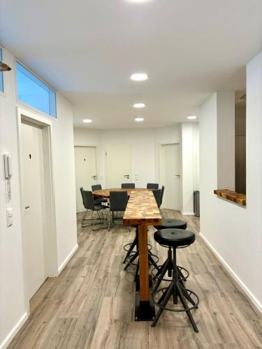an empty room with a table and chairs at Check In by BeOne in Villingen-Schwenningen