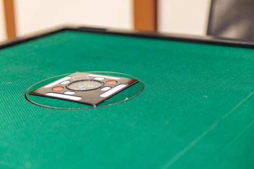 a cell phone sitting on top of a pool table at 春夏秋冬 in Hakone