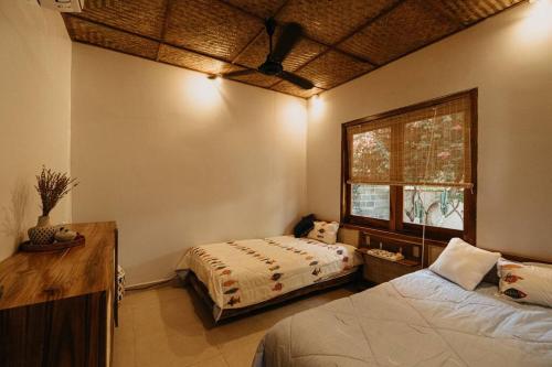 Ένα ή περισσότερα κρεβάτια σε δωμάτιο στο Coconut Beachfront Villa - Mui Ne