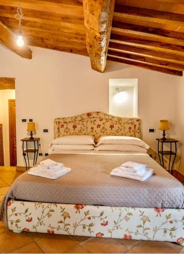 Postel nebo postele na pokoji v ubytování Casale in Val D Orcia
