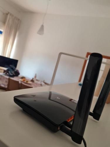 a black printer sitting on top of a table at A CASA di ROSA,fronte spiaggia, piscina,parcheggio in Trapani