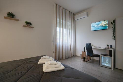Televisyen dan/atau pusat hiburan di Zaro Suites B&B
