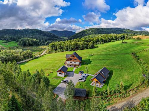 an aerial view of a large house in a green field at Siwejka - Ropki - Beskid Niski in Ropki