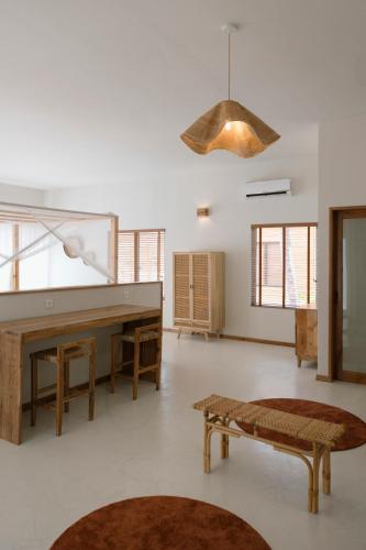 a large living room with a piano and a bench at Sentidos Beach Retreat in Miramar
