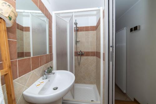 a bathroom with a sink and a shower at Santa Sofia Affittacamere in Gravina in Puglia