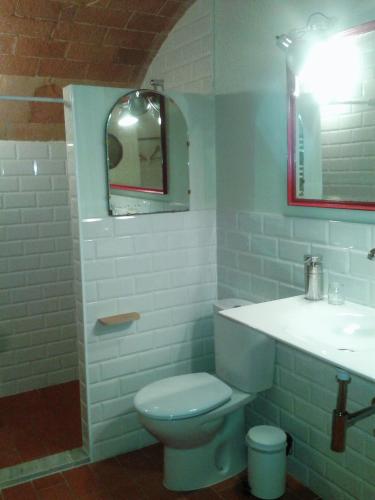 a bathroom with a toilet and a sink at Marakasa B&B in Sant Antoni de Calonge