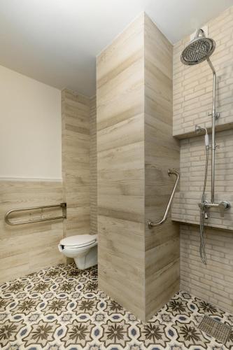 a bathroom with a toilet and a shower at Meydani Suites in Litochoro