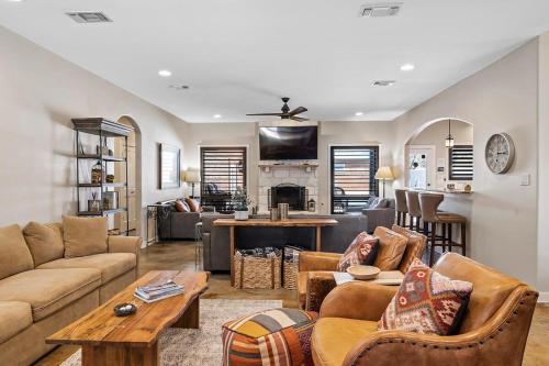 a living room with a couch and a table at 4 Bedroom Close to Downtown Hot Tub-Pool in Fredericksburg