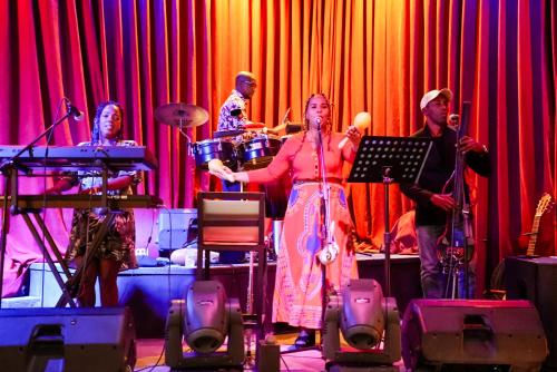 a group of people playing instruments on a stage at Manuela Boutique Hotel Bitez in Bitez