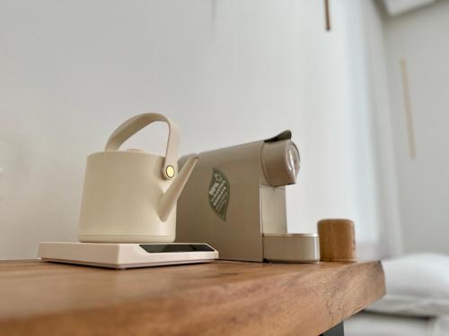 a sewing machine sitting on top of a wooden table at Anno13Suites in Naples