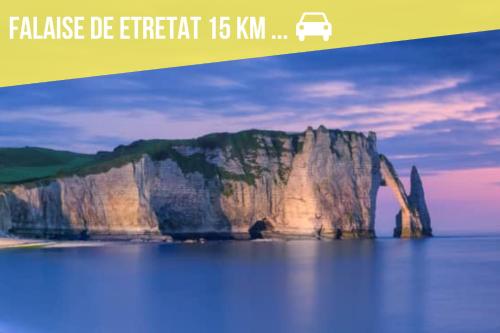 a poster with a picture of a mountain in the water at Jacuzzi Romantique 15 min Etretat 3 in Fécamp