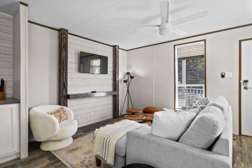 a living room with a couch and a chair at Leisure Escape - TX Hill Country in Dripping Springs