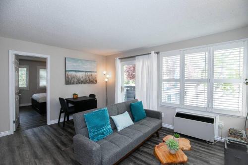 a living room with a couch and a table at Mountainside Retreat in Blue Mountains