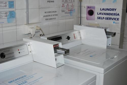 a white laboratory with two machines on a counter at Estudiotel Alicante in Alicante