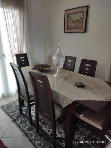 a dining room table with chairs and a table and a table and chairsktop at Villa Mary in Makrýgialos