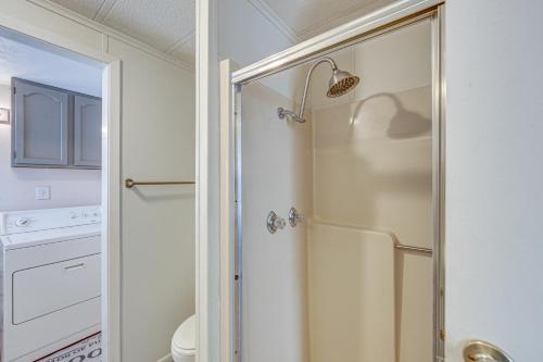 a shower with a glass door in a bathroom at Lakefront Gun Barrel City Home with Dock and Deck in Gun Barrel City