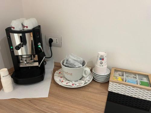 a coffee maker sitting on a counter with a coffee cup at Casa Vacanza SANTA TERESA in Brindisi