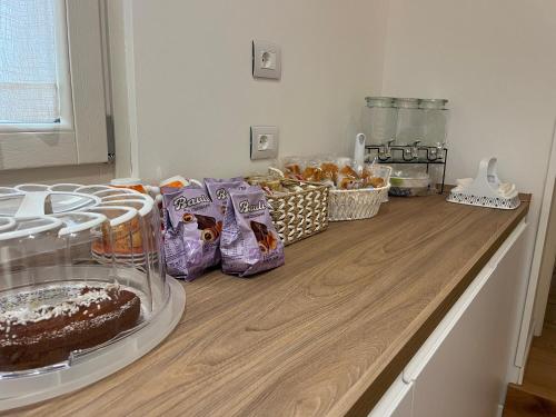 a counter with a chocolate cake and snacks on it at Casa Vacanza SANTA TERESA in Brindisi