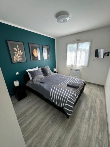 Ένα ή περισσότερα κρεβάτια σε δωμάτιο στο Confortable Maison Avenue du Cap Ferret