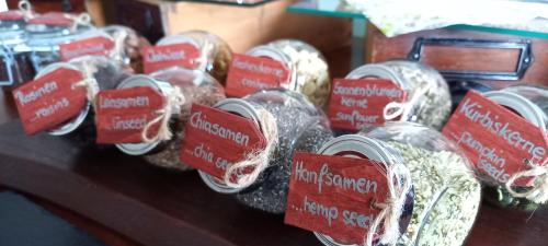 a group of jars of food on a table at Gästehaus Wohngut Eisenach in Eisenach