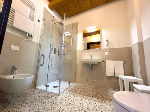 a bathroom with a glass shower and a sink at Azienda Agrituristica Il Pago in Nova Siri Marina